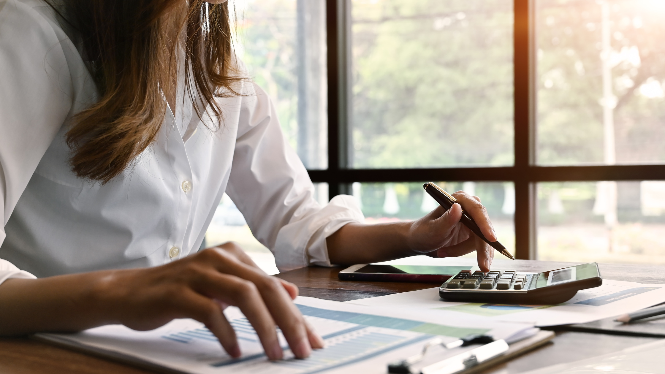 Female Fractional Controller Working on Reports