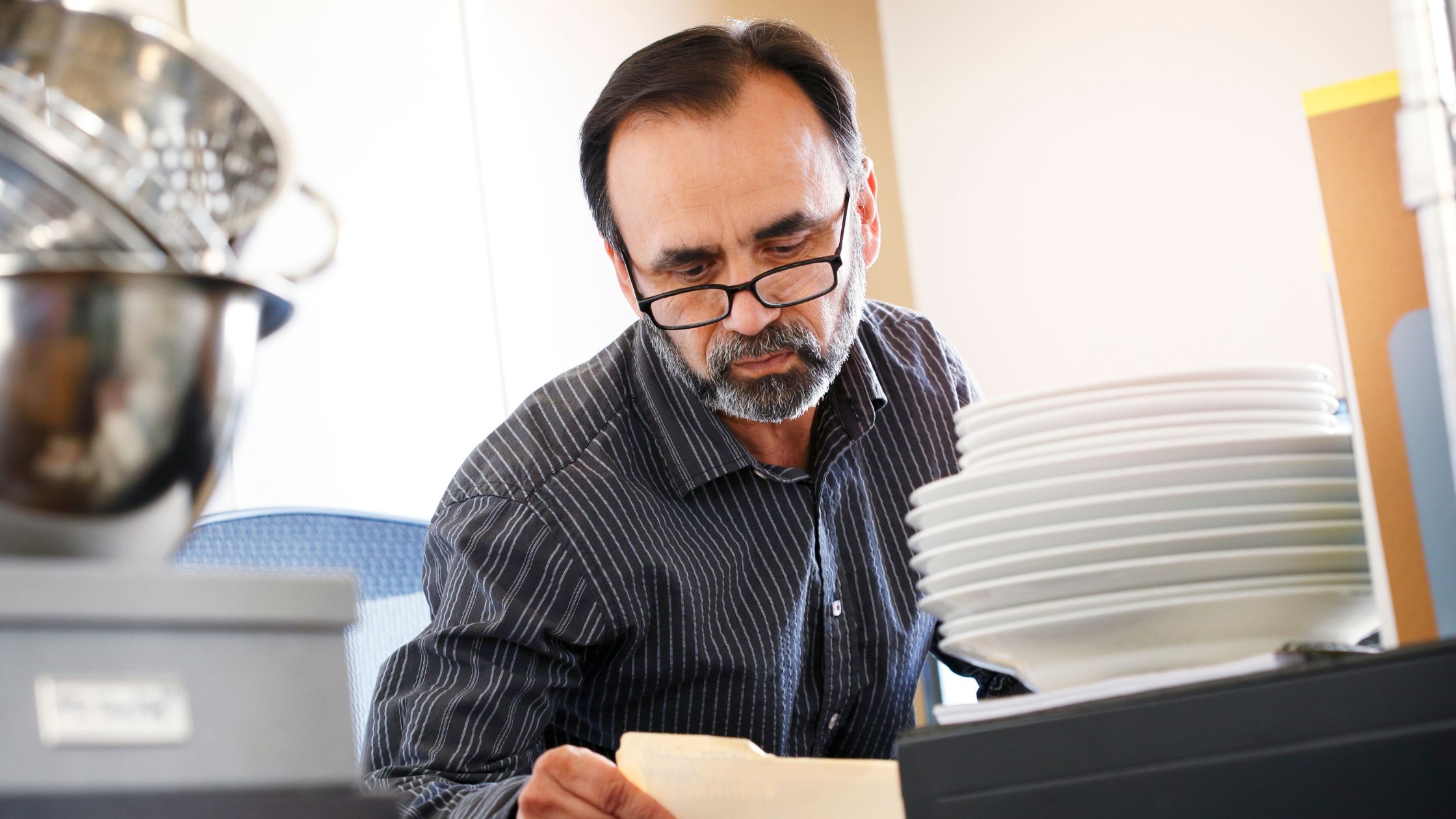 Small business owner looking at audit files