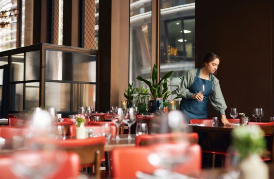 Female waitress setting tables Female waitress setting tables
